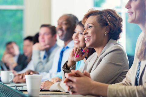 woman with colleagues in boardroom